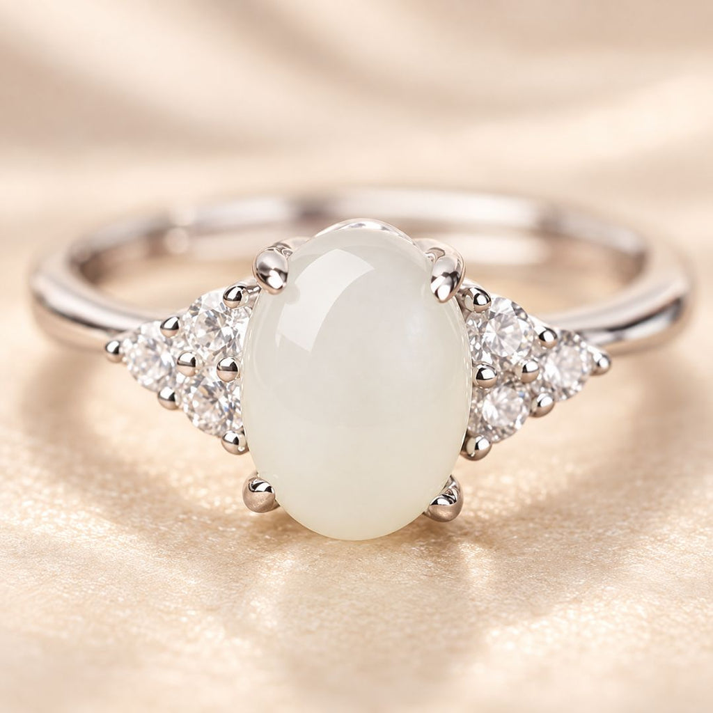 Close-up of Elaris Moonstone Ring with oval white moonstone and clear accent stones