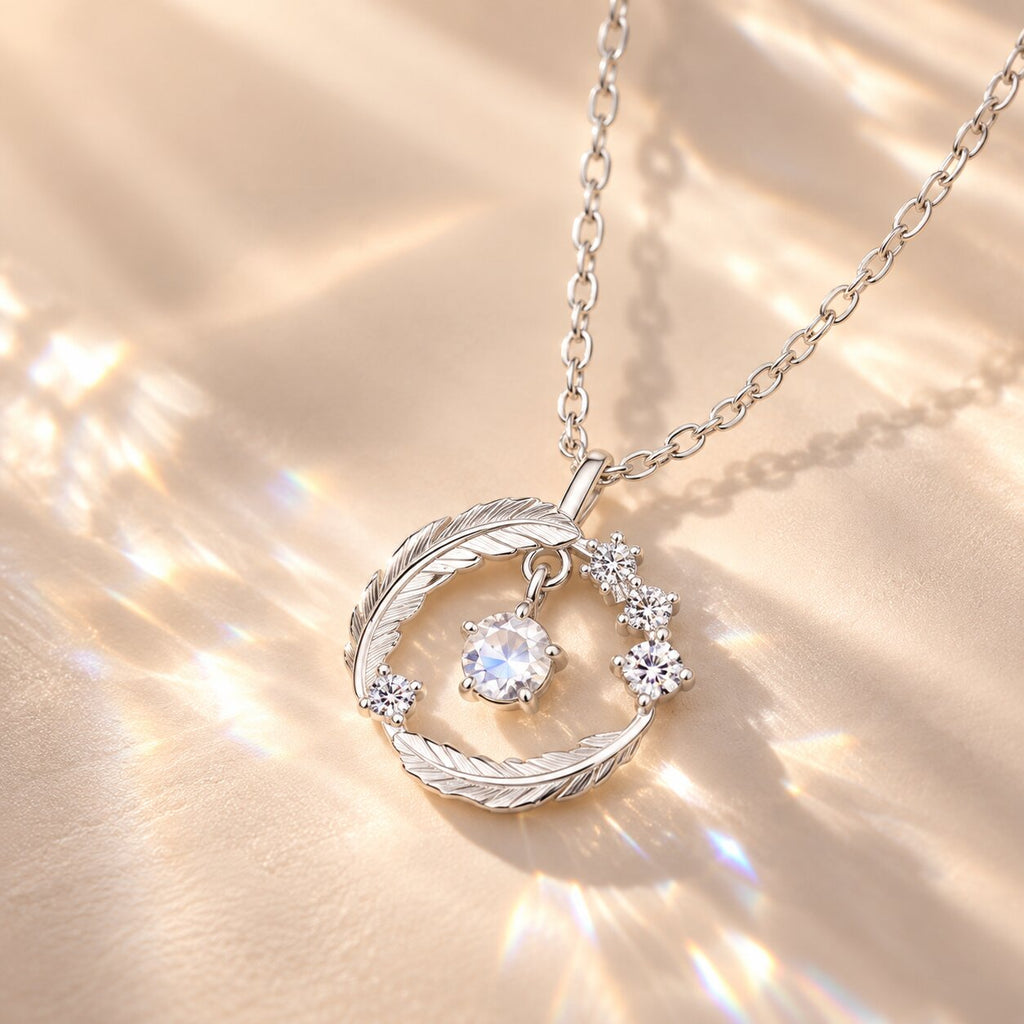ELYRA Feather Moonstone Necklace close-up showing the luminous gemstone reflecting soft light