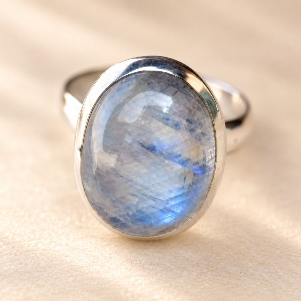 Luna Moonstone Ring close-up showing the oval moonstone and natural blue iridescence